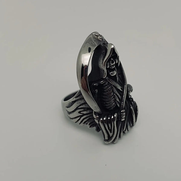 stainless steel ring depicting the grim reaper with his scythe, shown 3/4 view