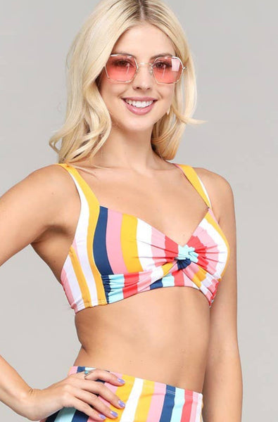 retro style swim top in a white, orange, pink, blue, and mint multi-color vertical cabana stripe, featuring twist-front detail, sweetheart neckline, removable light padding, and adjustable wide set straps and bottom band, shown on model