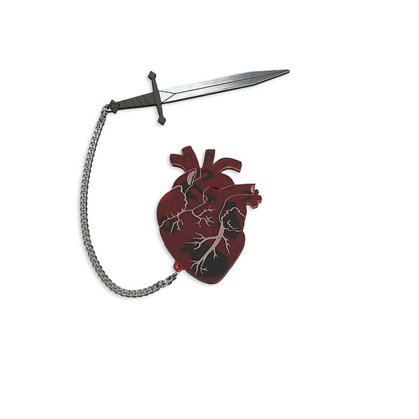 frosty translucent red anatomical heart layered over black laser cut acrylic brooch with removable tiny silver metal chain tethered black & metallic silver sword