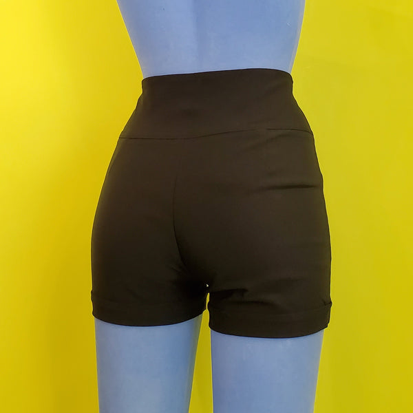 fitted black stretch high-waist cuffed shorts front zipper and four-button wide waistband closure front pockets, shown back view on blue mannequin,