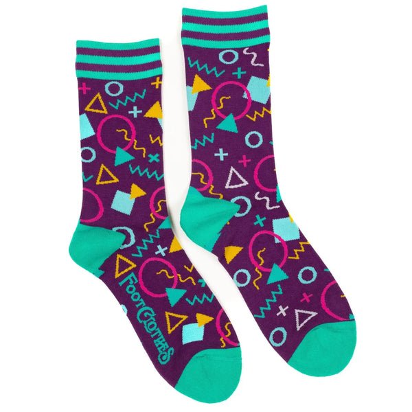 Unisex crew socks in a geometric 80s pattern on a purple background