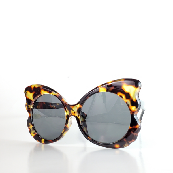 shiny tortoiseshell pattern plastic butterfly shaped frame sunglasses with round dark smoke lens