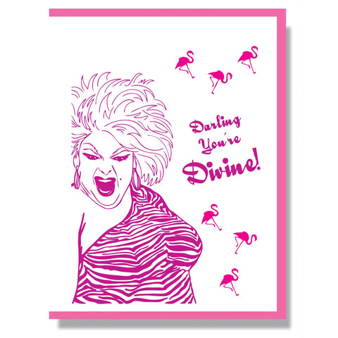 A rectangular note card with an image of Divine surrounded by pink flamingos with the message “Darling you’re divine” in neon pink and purple