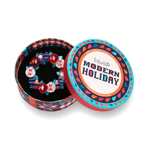 Modern Holiday Collection "A Jolly Christmas" layered resin brooch comprised of multi-color retro style Christmas ornaments, shown in illustrated round box packaging