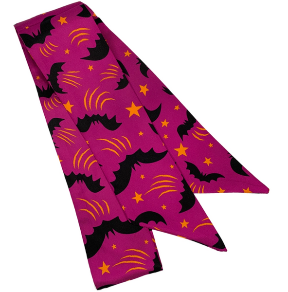 purple background allover black bats and golden orange stars print 1.75" x 36" skinny polyester twill scarf