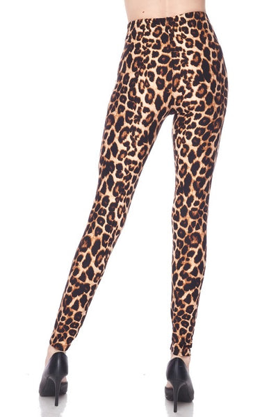 High-waisted super stretchy brushed fiber (soft like the skin of a peach!) leggings in a classic leopard print. Shown on a model from behind