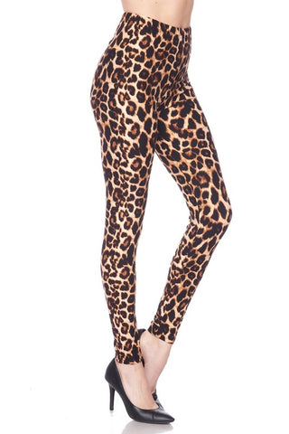 High-waisted super stretchy brushed fiber (soft like the skin of a peach!) leggings in a classic leopard print. Shown on a model from the side at a three quarter angle