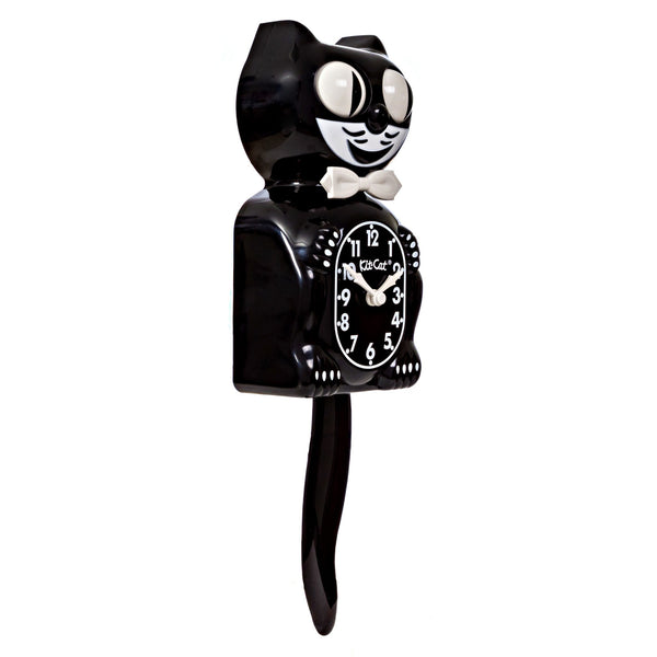 black & white Kit-Cat wall mount clock features a mischievous grin, and big round eyes that swivel side-to-side in time with its pendulum tail 