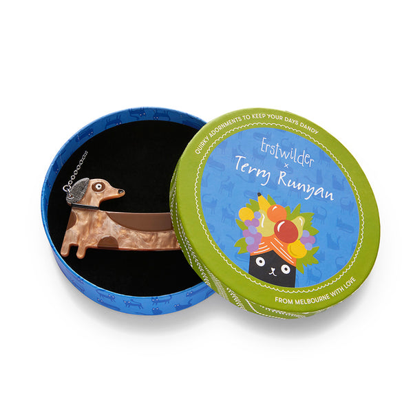 Terry Runyan Collaboration Collection "Long Dog" dachshund pendant necklace, shown in illustrated round box packaging