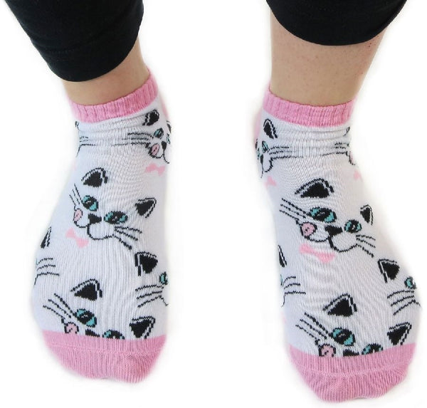 white ankle sock with allover black outline cat faces with pink tongues and bow-ties print, shown on model