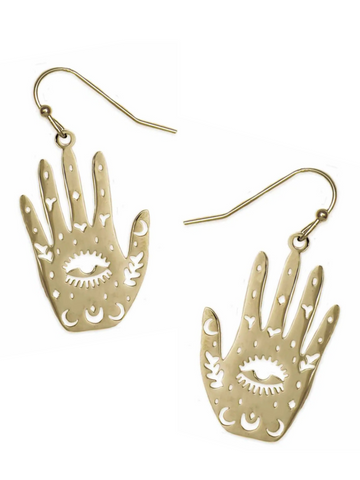 stylized pair of hand dangle earrings in gold metal with cutout details of eyes, moons, and hearts