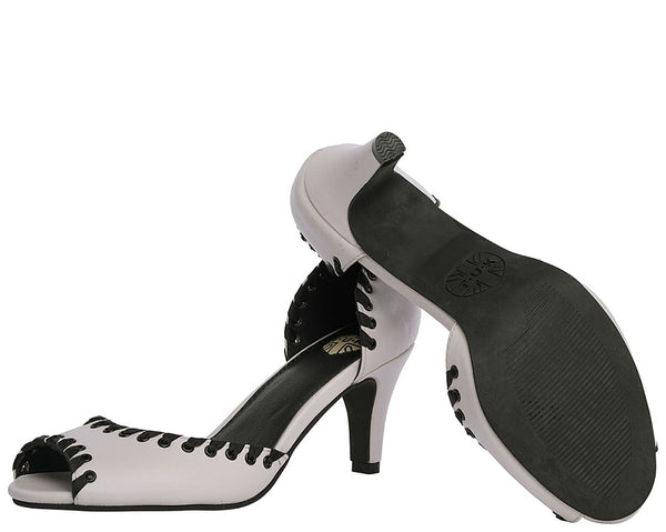 cream peep toe heels with black riveted eyelets with satin ribbon woven through