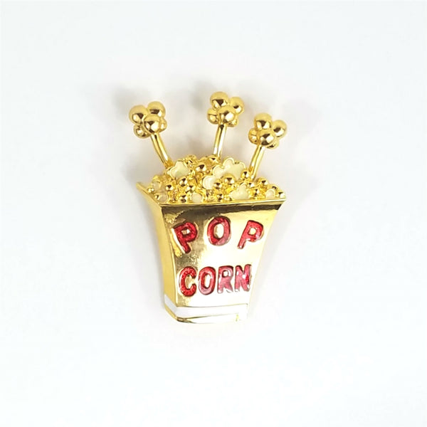 shiny gold metal "POP CORN" container brooch with red enameled lettering