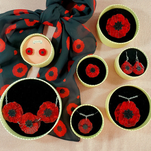 Poppy Field collection of brooches, earrings, necklaces, and scarf