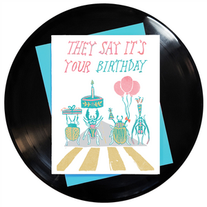 4.25" x 5.5" card with "They Say It's Your Birthday" text over multi-color celebratory beetles on Abbey Road stamped image against white background