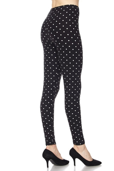 stretch knit high-waist leggings in back with white polka dot print, shown on model