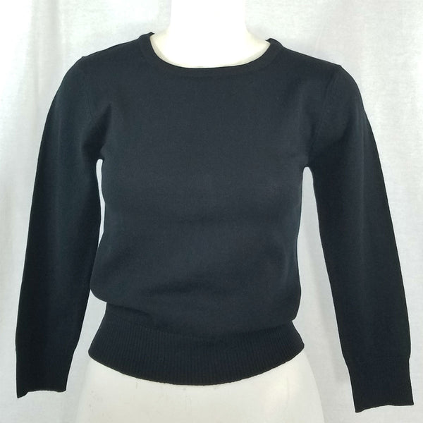 black fitted pullover sweater in a slightly cropped length with crew neck and 3/4 sleeves, shown on mannequin