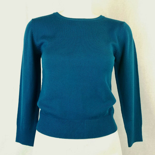fitted pullover sweater in a slightly cropped length with crew neck and 3/4 sleeves in rich teal blue, shown on mannequin