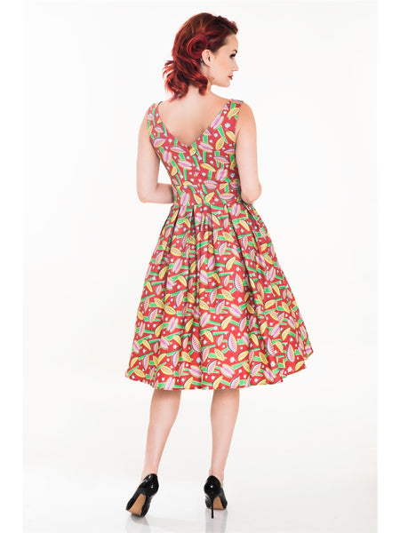 red background Venus Fly Trap print dress sleeveless fitted high neckline princess seamed bodice, wide banded waist, full gathered just below the knee length skirt, shown on model back view