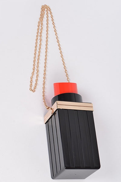 red lipstick tube shaped black acrylic bag with hinged top opening and detachable gold chain shoulder strap, measuring 3" x 8.5" x 3"