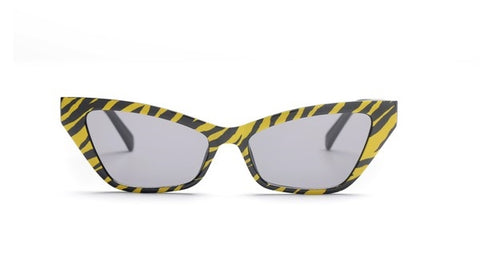 yellow & black tiger print angled cat eye sunglasses with black arms and smoke lens