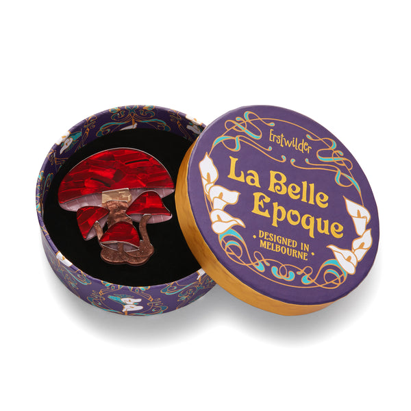 La Belle Époque Collection "A Touch of Magic" layered resin mushroom brooch, shown in illustrated round box packaging
