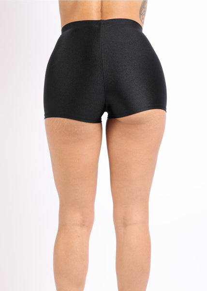high waisted shiny black tricot knit short shorts shown worn by model in close up from back