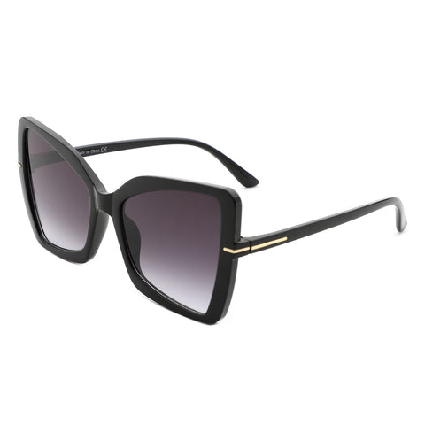 Rectangular black cat eye sunglasses with gold details at the temples and arms with smoke gradient lenses. Shown from the side