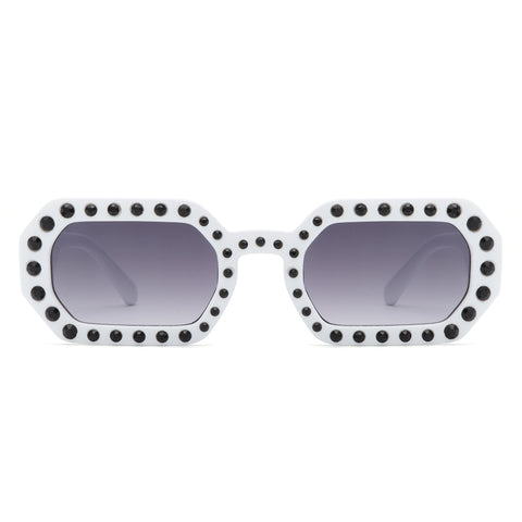 octagon shaped white sunglasses with black rhinestones in alternating sizes along the frames and arms. Shown from the front