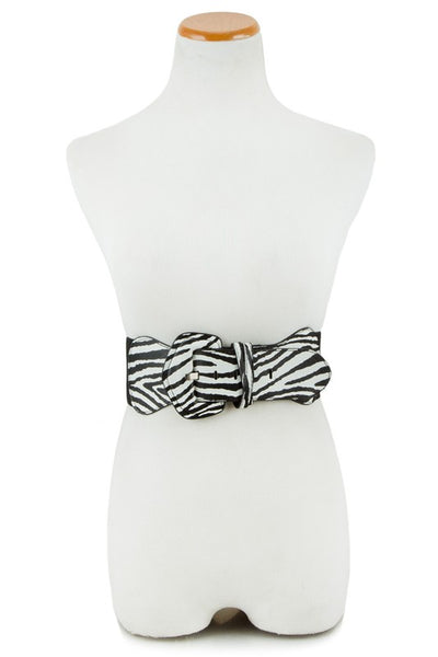 Zebra print belt with a self buckle and black elastic back on a dress form