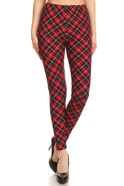 High-waist leggings in a black, cream, and red diagonal plaid print. Shown on a model from a front angle