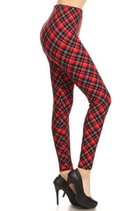 High-waist leggings in a black, cream, and red diagonal plaid print. Shown on a model from a side angle