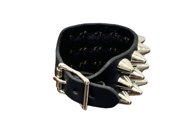 3 row English cone studded black leather cuff with silver metal buckle. Shown closed from back to display buckle