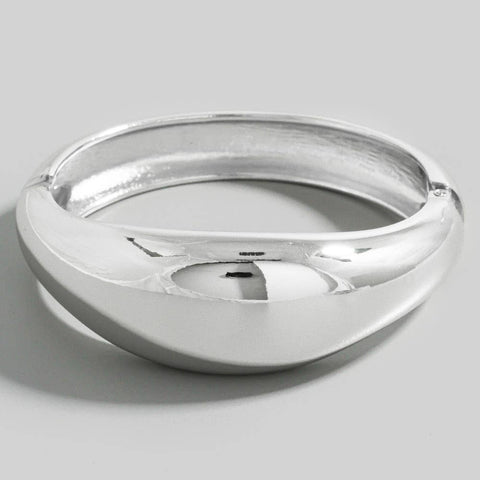 silver metal hinged bangle with asymmetrical rounded front