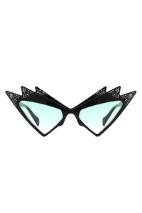 A pair of shiny black ultra geometric cat eye sunglasses with three points at the top of each eye and stamped in mock rhinestones, silver stars, and green gradient lenses