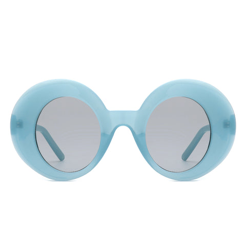 pair of cartoony semi-translucent retro round sunglasses with thick frames in a dusty robin’s egg blue and vertical oval shaped dark smoke lenses