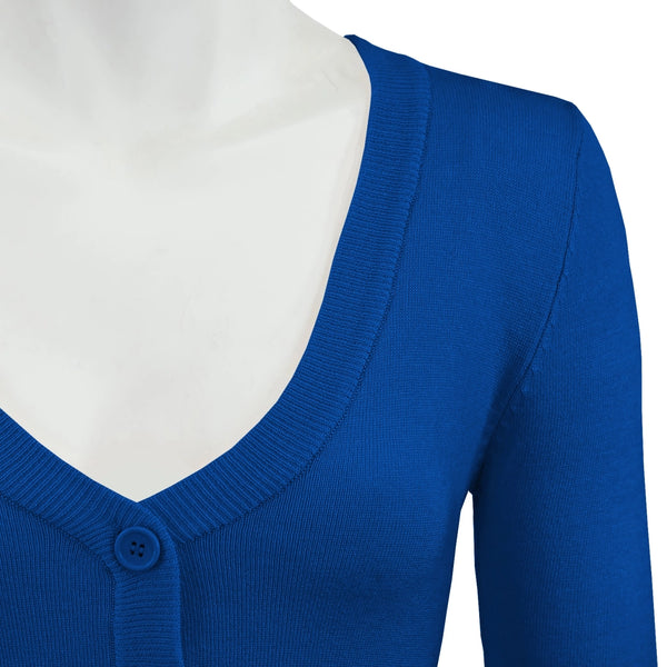 3/4 sleeve v-neck cropped cardigan with three matching color plastic buttons closure in a bright royal blue, showing cropped close-up of neckline and one shoulder