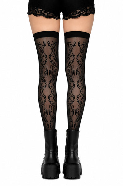 model wearing sheer black stay up thigh highs with allover flocked pattern of spiders and filigree webs. Shown from back