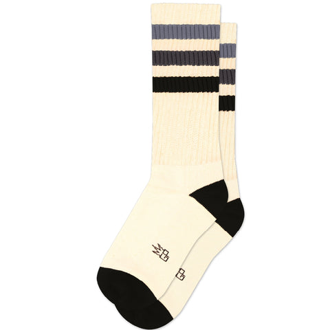 Unisex warm cream colored crew socks with black toes and heels & striped cuffs in three shades of grey