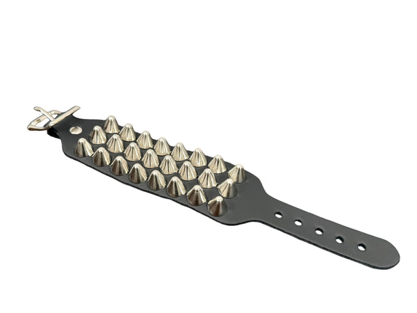 3 row English cone studded black leather cuff with silver metal buckle. Shown flat