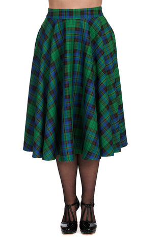 Model wearing a 50s style swing skirt in a bright green, blue, black, and red plaid pattern. Shown from the front