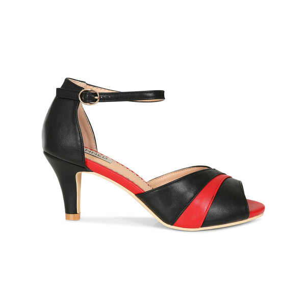 a pair of faux leather peep-toe heels with black and red striped toe strap, black ankle strap with gold metal buckle, and red insole. shown from side