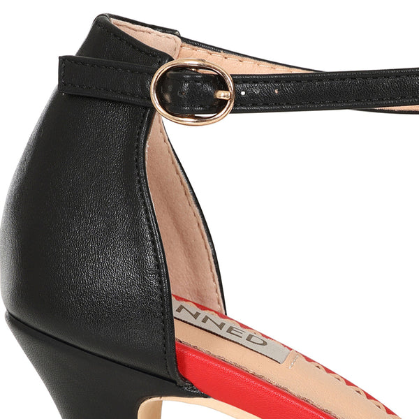 a pair of faux leather peep-toe heels with black and red striped toe strap, black ankle strap with gold metal buckle, and red insole. shown in close up of ankle strap and hardware