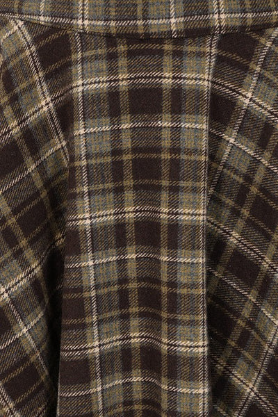high waisted wool blend full circle swing skirt in deep brown, beige, yellow, and blue plaid pattern with side seam pockets. Shown in close up for pattern detail