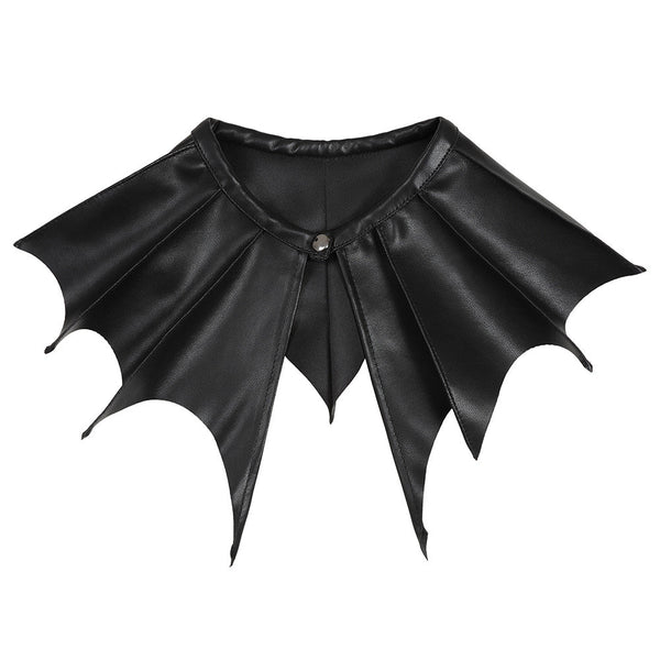 black textured faux leather collar with gunmetal tone metal snap closure in exaggerated batwing shape with scalloped edges. Shown from front