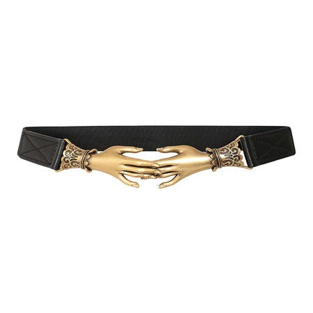 A black elastic wait belt featuring a large gold-toned metal buckle shaped like two hands clasped together, with ornate decorative details on either side, shown against a plain white background.