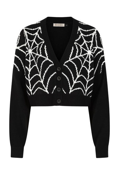 A black cropped cardigan sweater with a bright white jacquard knit-in spiderweb pattern across the chest and shoulders, featuring a V-neck and four front buttons. Shown from front