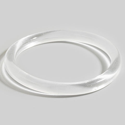 Tubular shaped translucent resin bangle shown flat