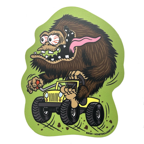 die-cut sticker of Sasquatch depicted in Rat Fink style art with tongue sticking out driving a yellow 4x4 jeep on bright green background