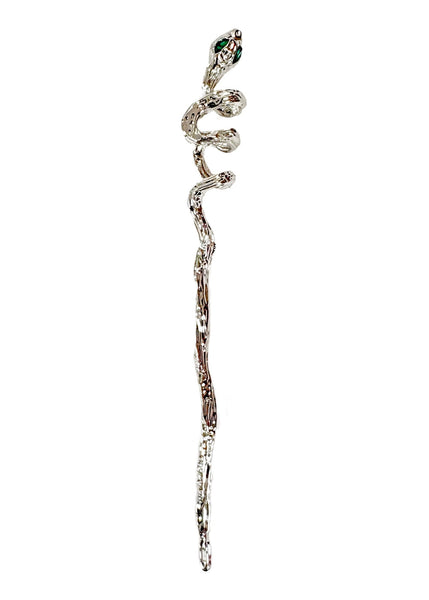 Silver coiled snake-shaped hair pin with large almond-shaped green jeweled eyes shown on white background 